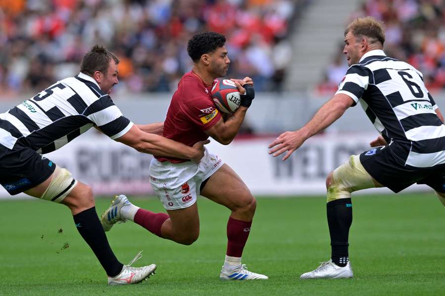 Richie Mounga is tackled during the Japan League One Play-off final earlier this year.