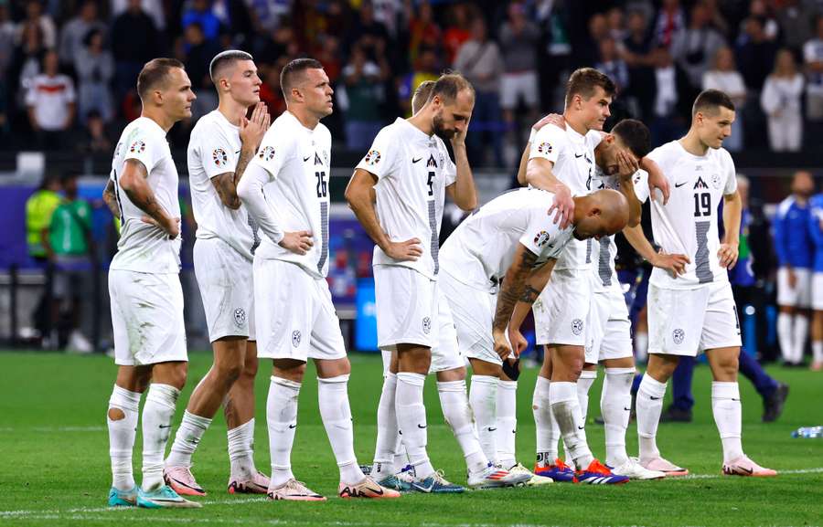 Slovenia players look dejected during the penalty shootout