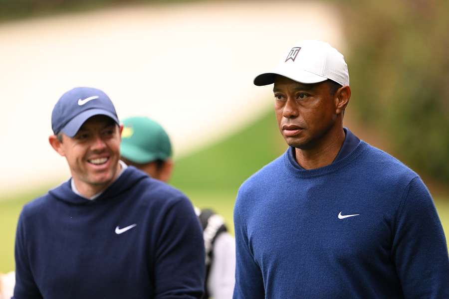 World number two Rory McIlroy (L) and 15-time major winner Tiger Woods