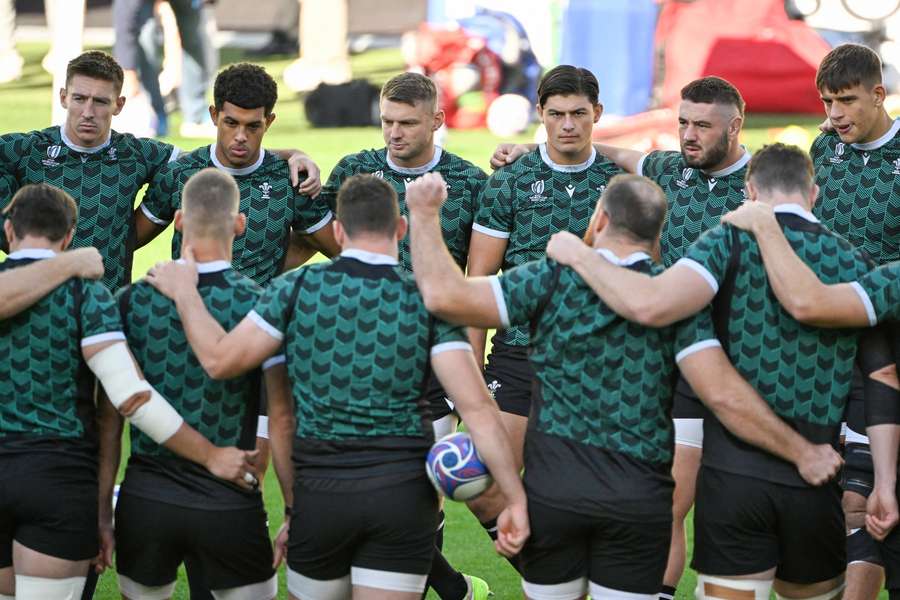 Wales' players including fly-half Dan Biggar (2L) and wing Louis Rees Zammit attend the captain's run