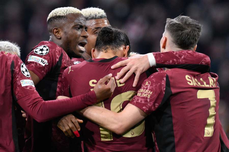 Galatasaray's Victor Osimhen (L) celebrates scoring against Ajax Galatasaray's Victor Osimhen (L) celebrates scoring against Ajax