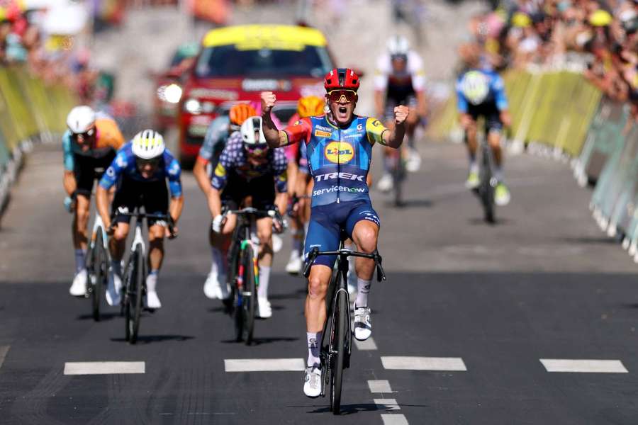 Mads Pedersen celebrates before crossing the finish line to win stage four Mads Pedersen celebrates before crossing the finish line to win stage four