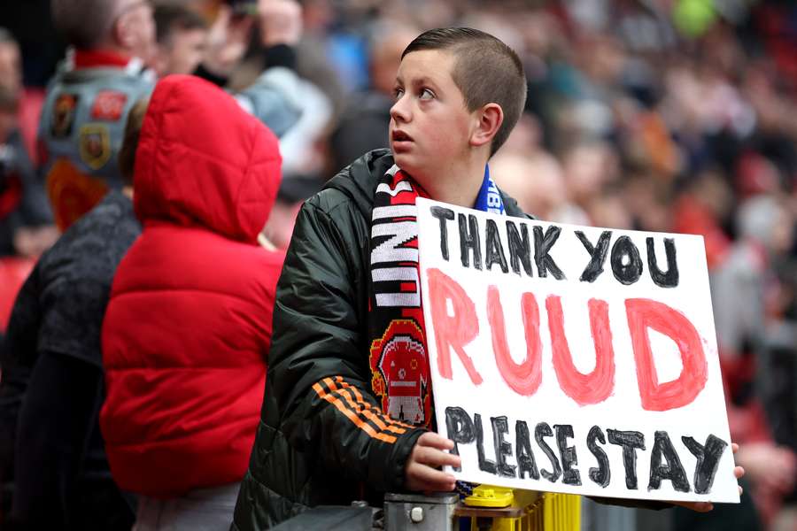 A young fan holds up a sign in support of Ruud van Nistelrooy