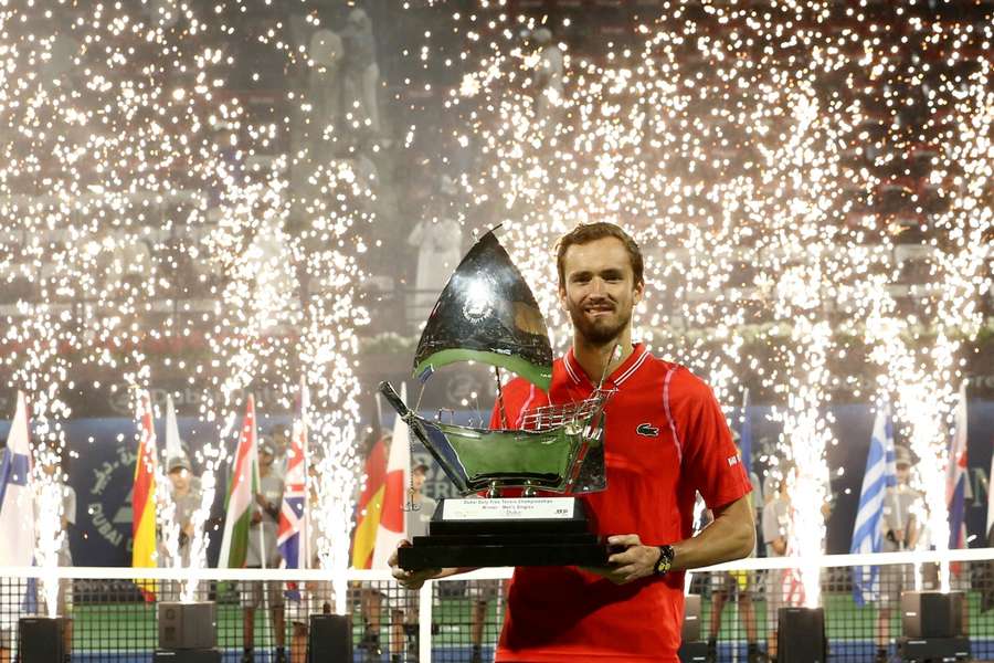 Russia's Daniil Medvedev poses with trophy after winning his final match