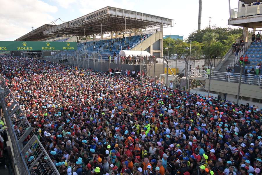 Fans watch the podium celebrations on the track, but some people apparently entered the track before the end of the race