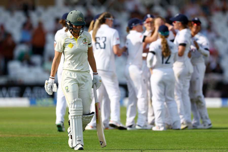 Ellyse Perry walks off after being dismissed for 99 off of the bowling of Lauren Filer