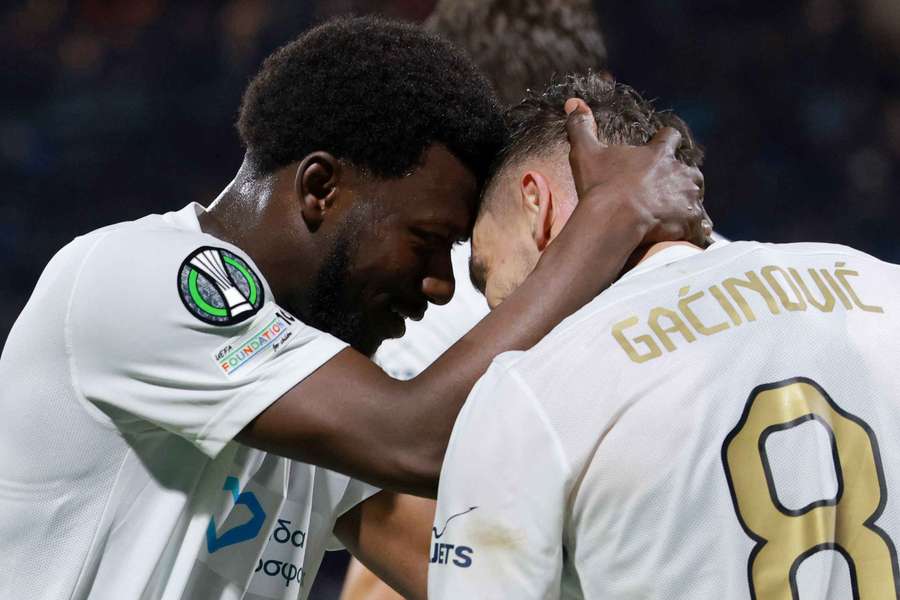 AEK Athens' Mijat Gacinovic celebrates scoring their third goal against Cejle with Aboubakary Koita