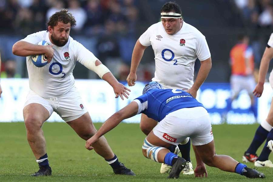 Stuart (L) in action against Italy