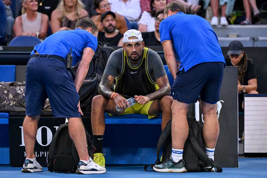 Nick Kyrgios is attended to by physios between points during his match against Jacob Fearnley