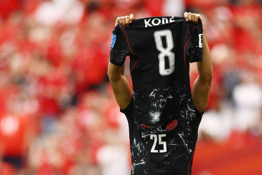 Nathan Saliba holds aloft Ismael Kone's shirt after scoring for Canada