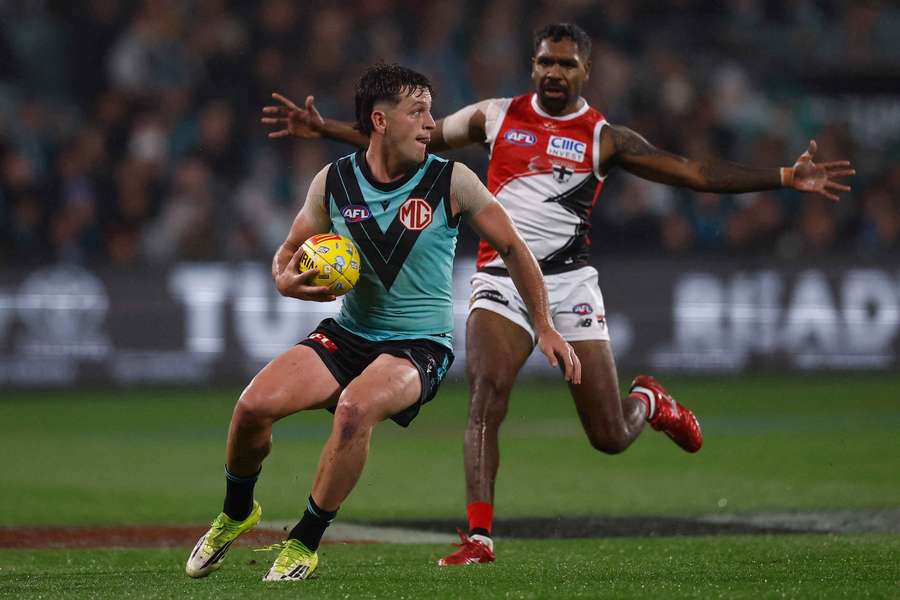 Zak Butters with ball in hand against St Kilda on Sunday night.