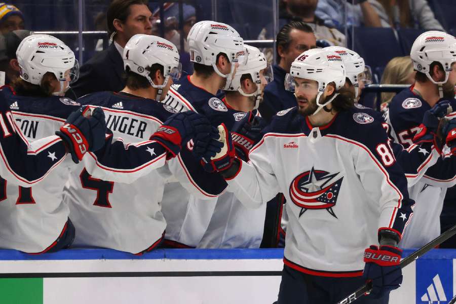 Blue Jackets right wing Kirill Marchenko celebrates his goal with teammates