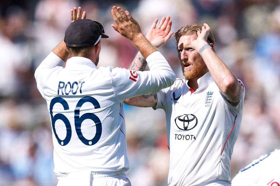 Root (left) and Stokes celebrate a wicket