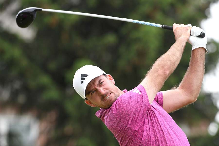 Nick Taylor hits his tee shot at the 17th hole during the third round