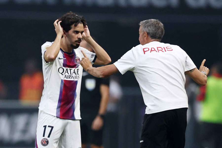 PSG boss Luis Enrique (right) speaks with Vitinha PSG boss Luis Enrique (right) speaks with Vitinha