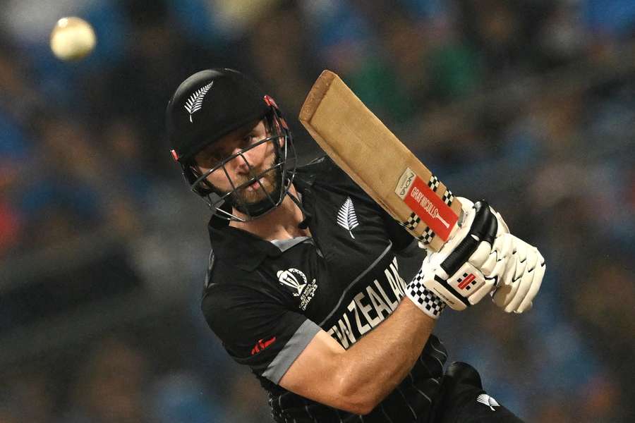 Kane Williamson watches the ball after playing a shot against India