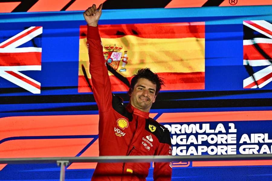 Carlos Sainz celebrates on the podium after winning the Singapore Grand Prix
