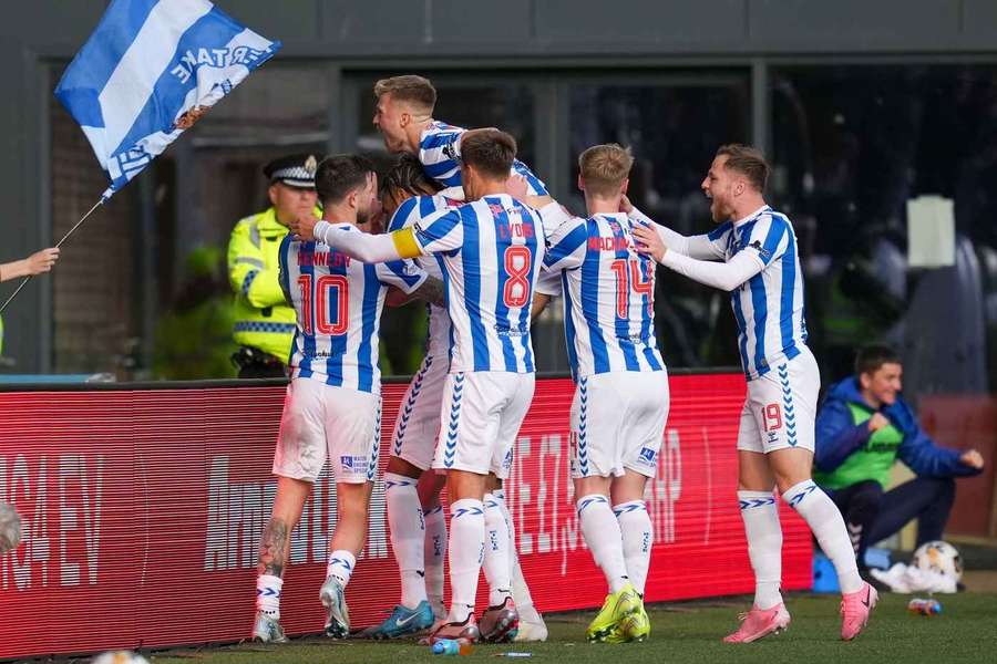 Marley Watkins of Kilmarnock celebrates with team mates after scoring