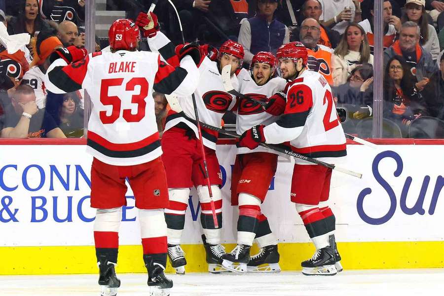 Hurricanes players celebrate goal in Game 4 against Flyers