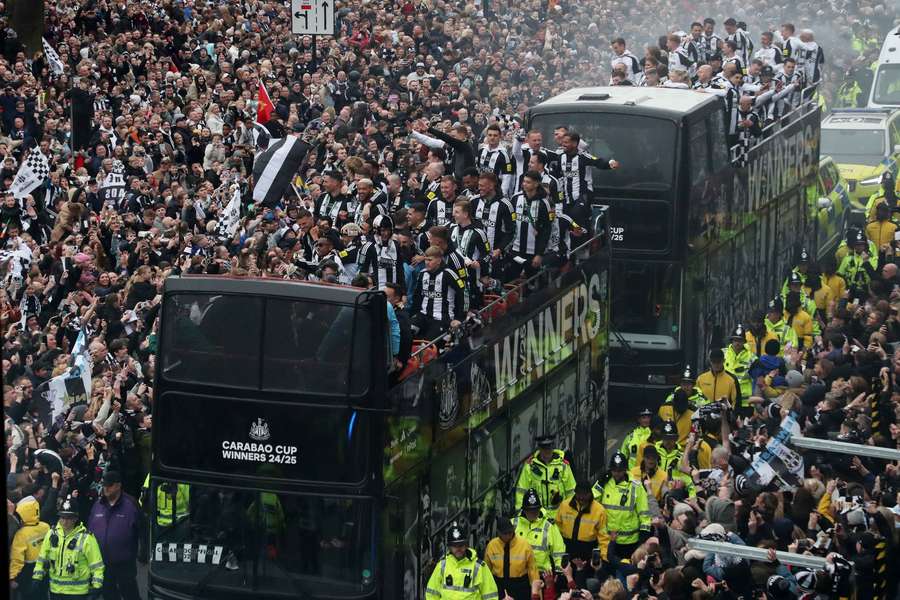 Newcastle United players celebrate on the bus during the victory parade