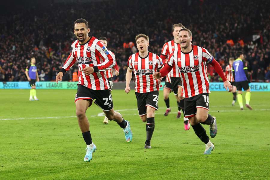 Sheffield United celebrate their only goal of the game to knock out Spurs
