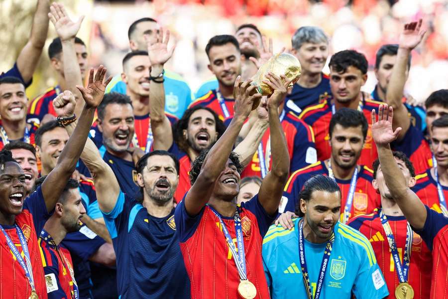 Spain's Lamine Yamal lifts the World Cup trophy aloft