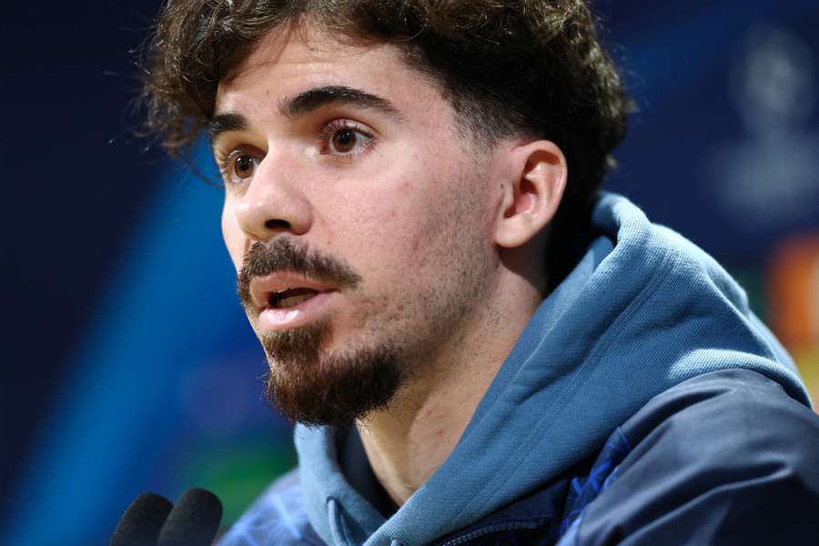 PSG midfielder Vitinha speaks during a press conference at the Campus Paris Saint-Germain