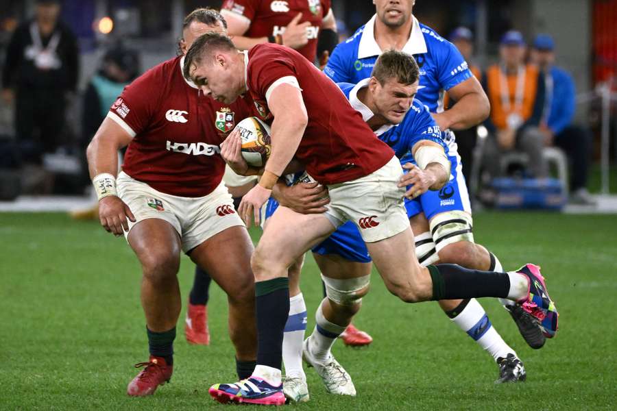 Western Force's Nick Champion de Crespigny lays a tackle on the Lions' Garry Ringrose earlier this month.