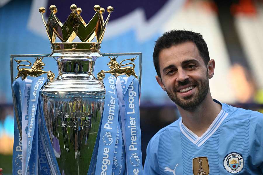 Manchester City midfielder Bernardo Silva poses with the Premier League trophy