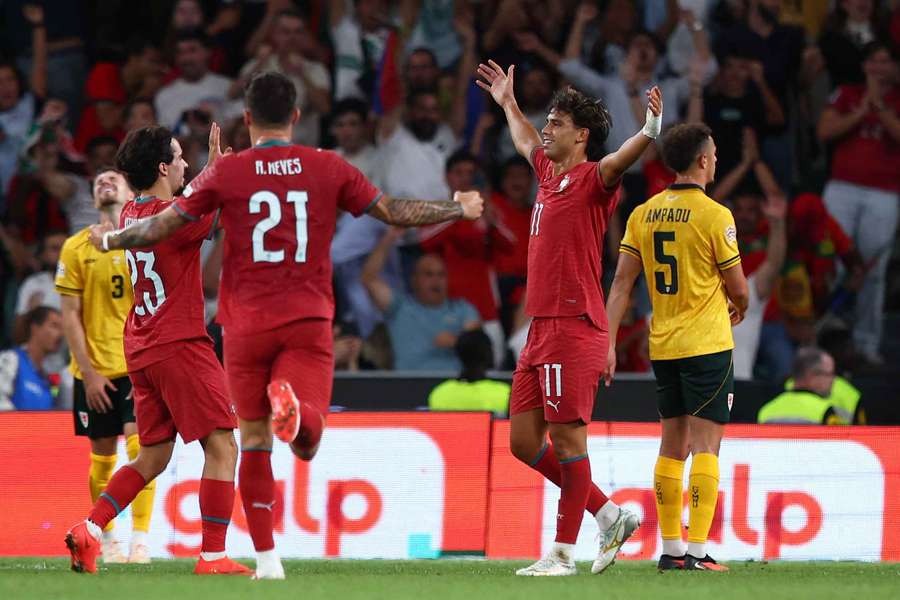 Portugal's Joao Felix celebrates scoring their first goal with Vitinha and Ruben Neves Portugal's Joao Felix celebrates scoring their first goal with Vitinha and Ruben Neves