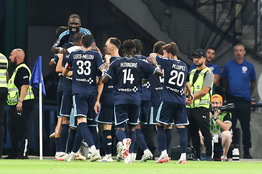 Lassine Sinayoko is heralded by his Paris FC teammates after his goal Lassine Sinayoko is heralded by his Paris FC teammates after his goal
