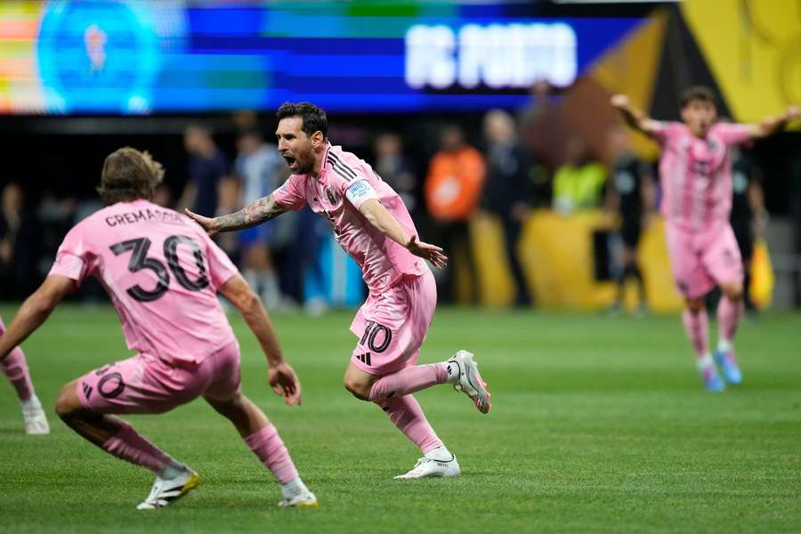 Lionel Messi celebrates his free kick