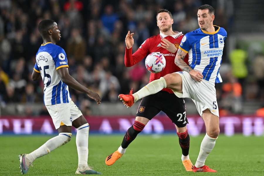 Lewis Dunk vies with Wout Weghorst