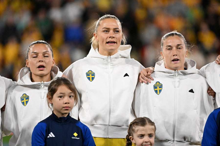 Sweden's Johanna Rytting Kaneryd, Fridolina Rolfo and Filippa Angeldahl line up during the national anthems at the World Cup