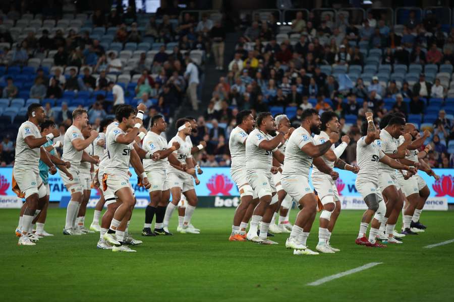 Moana Pasifika players perform a pre-game war dance on Friday night.