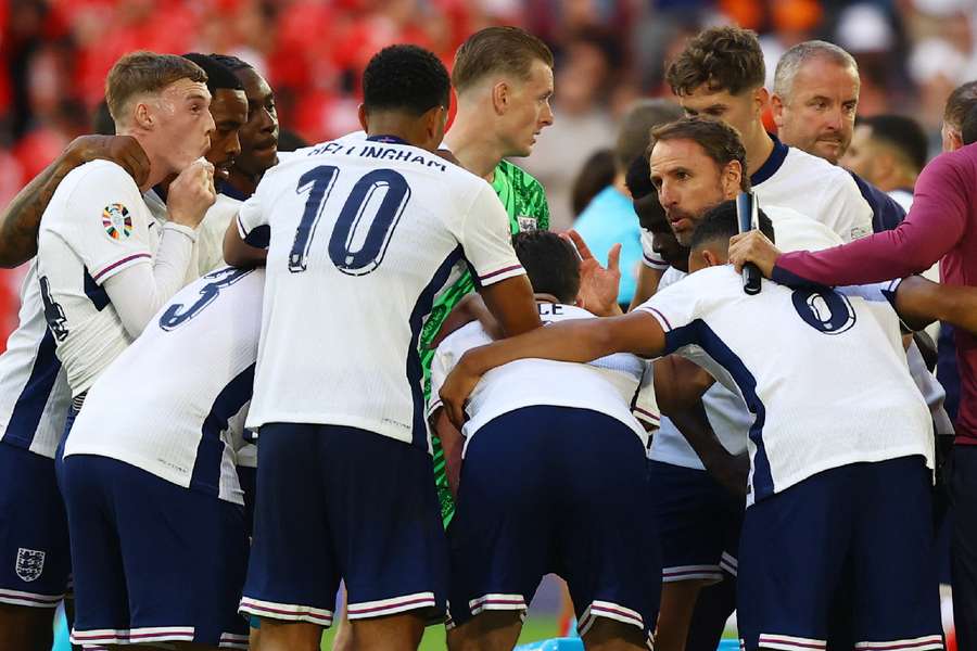 England manager Gareth Southgate with the players before the penalty shootout against Switzerland