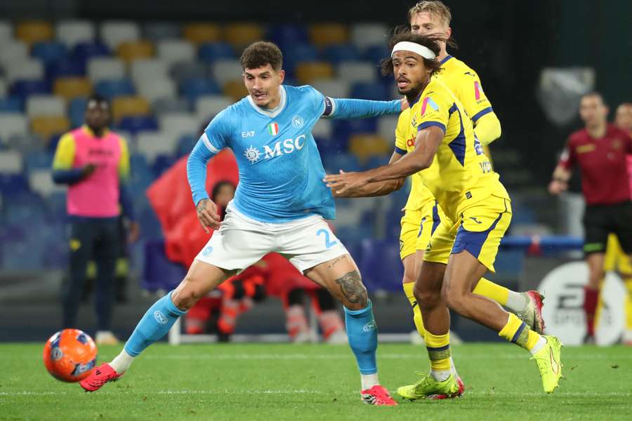 Giovanni Di Lorenzo fights for the ball with Hellas Verona's Antoine Bernede Giovanni Di Lorenzo fights for the ball with Hellas Verona's Antoine Bernede