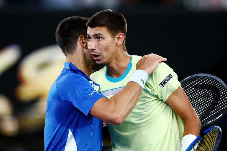 Djokovic embraces Popyrin after the game