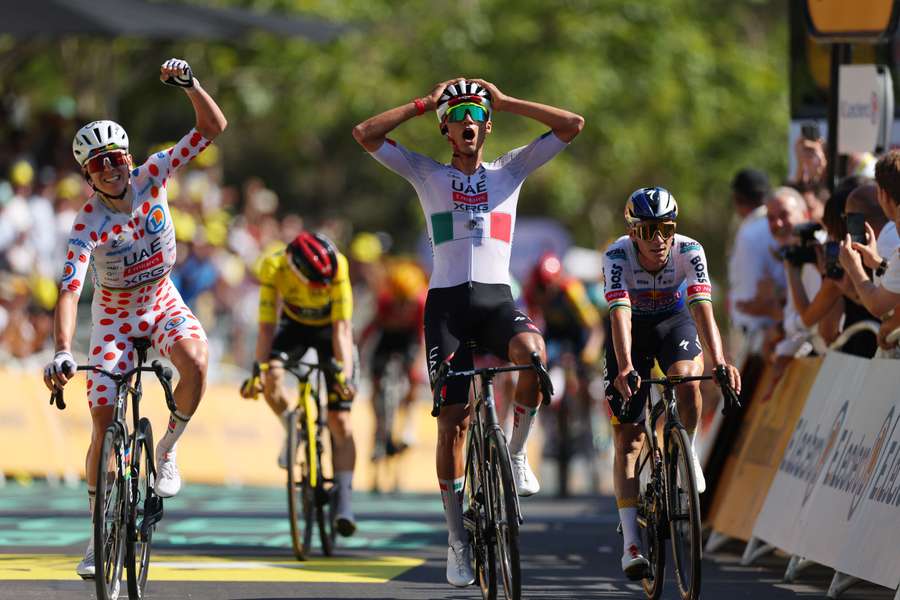 Isaac Del Toro celebrates winning stage two alongside Tadej Pogacar