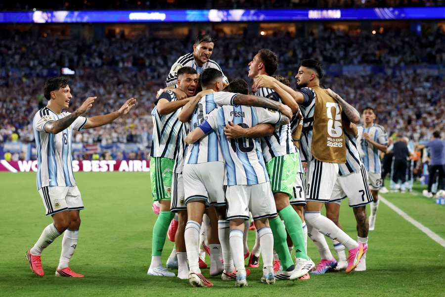 Cristian Romero celebrates after scoring Argentina's third goal with teammates Cristian Romero celebrates after scoring Argentina's third goal with teammates