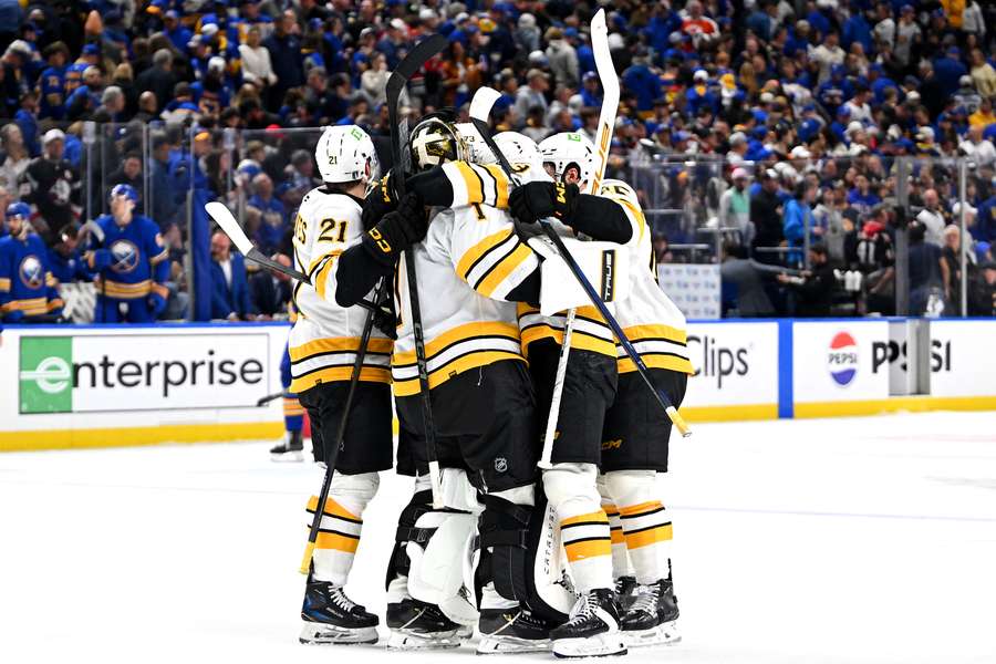 The Boston Bruins celebrated their winning goal against the Buffalo Sabres.