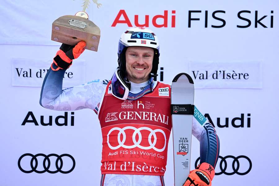 Henrik Kristoffersen celebrates on the podium