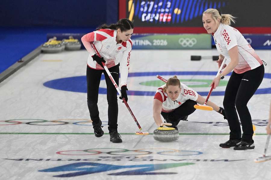 Denmark's Mathilde Halse delivers the stone during the curling women's round robin between South Korea and Denmark