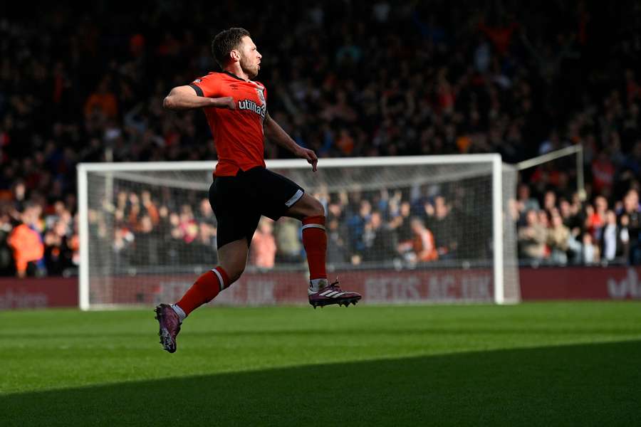Luton Town's English midfielder #18 Jordan Clark celebrates after scoring their first goal