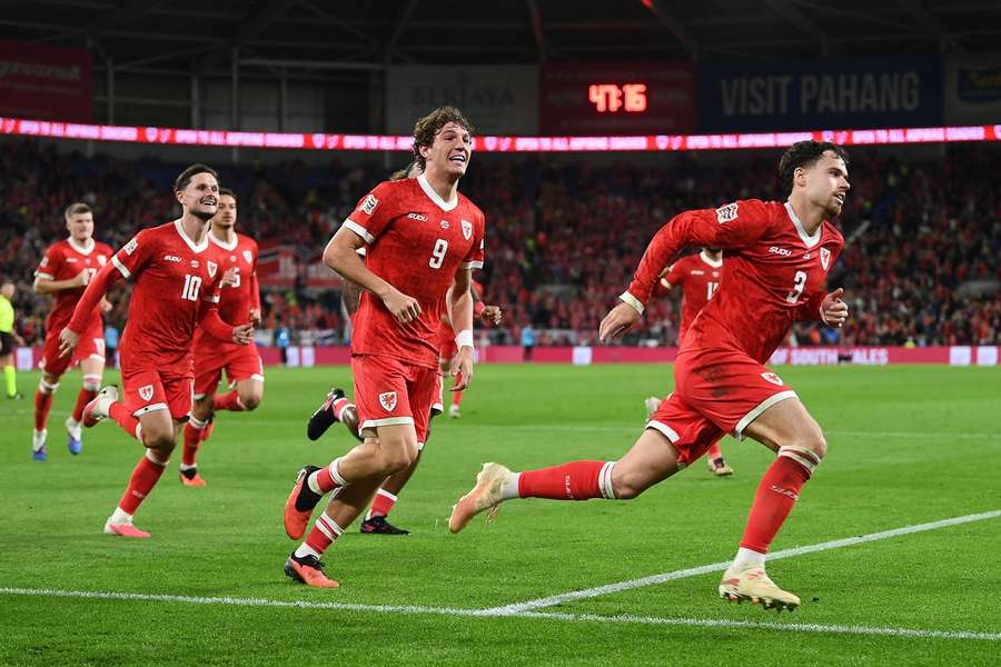 Wales' Neco Williams celebrates scoring a goal against Norway with his teammates Wales' Neco Williams celebrates scoring a goal against Norway with his teammates
