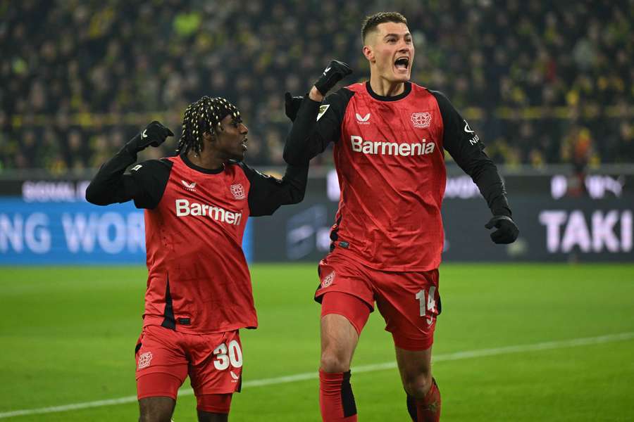 Bayer Leverkusen's Patrik Schick (right) celebrates his goal with Jeremie Frimpong against Dortmund