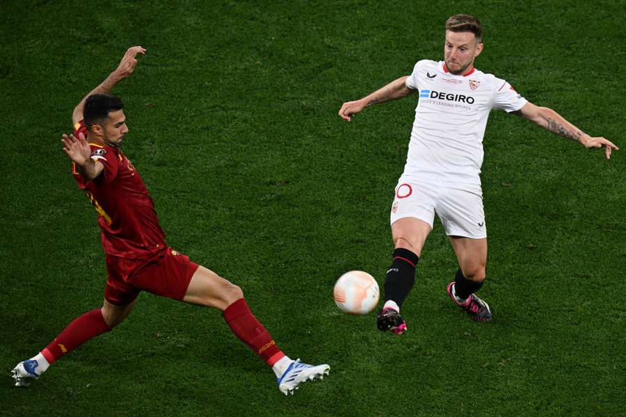 Ivan Rakitic and Zeki Celik vie for the ball