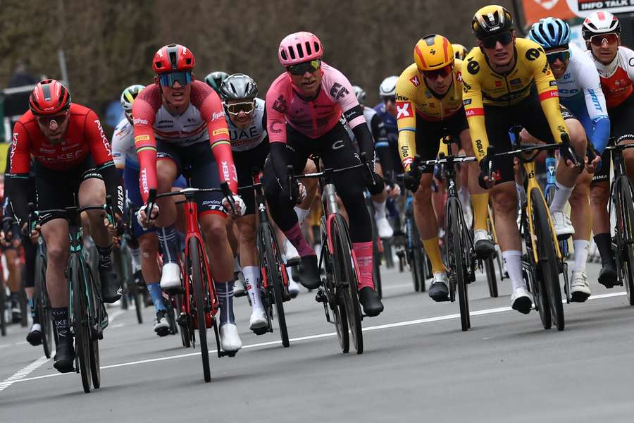 Trek-Segafredo's Danish rider Mads Pedersen (2L) crosses the finish line