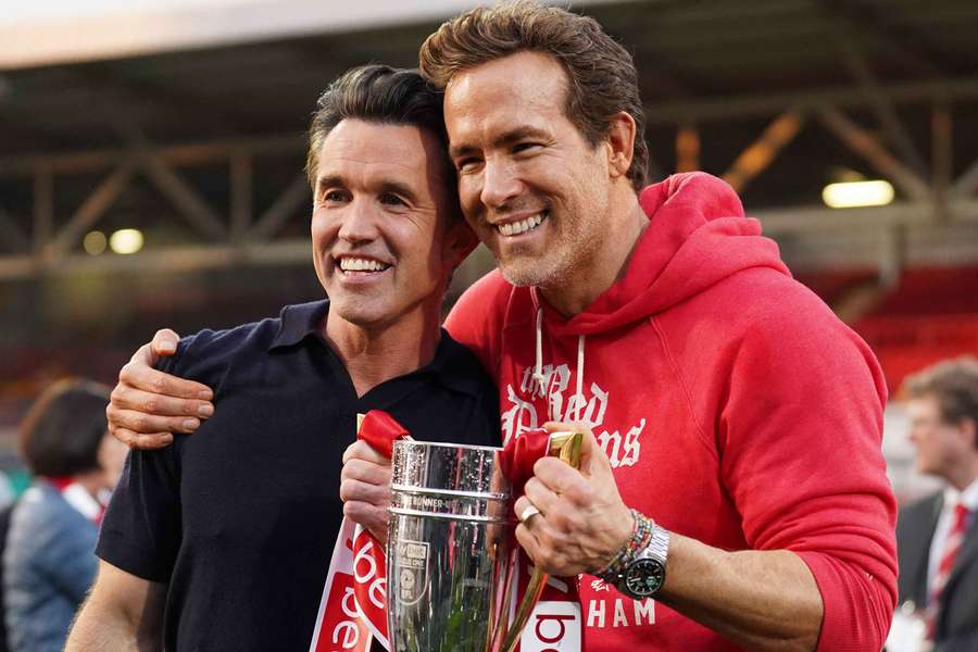 Rob McElhenney and Ryan Reynolds, co-owners of Wrexham AFC, pose for a photo 