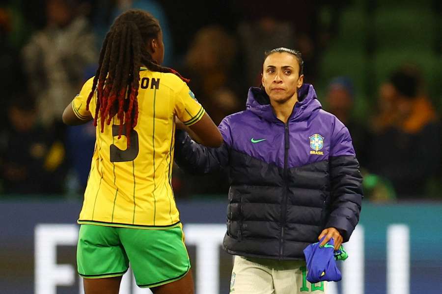 Marta is consoled by a Jamaican player following the goalless draw